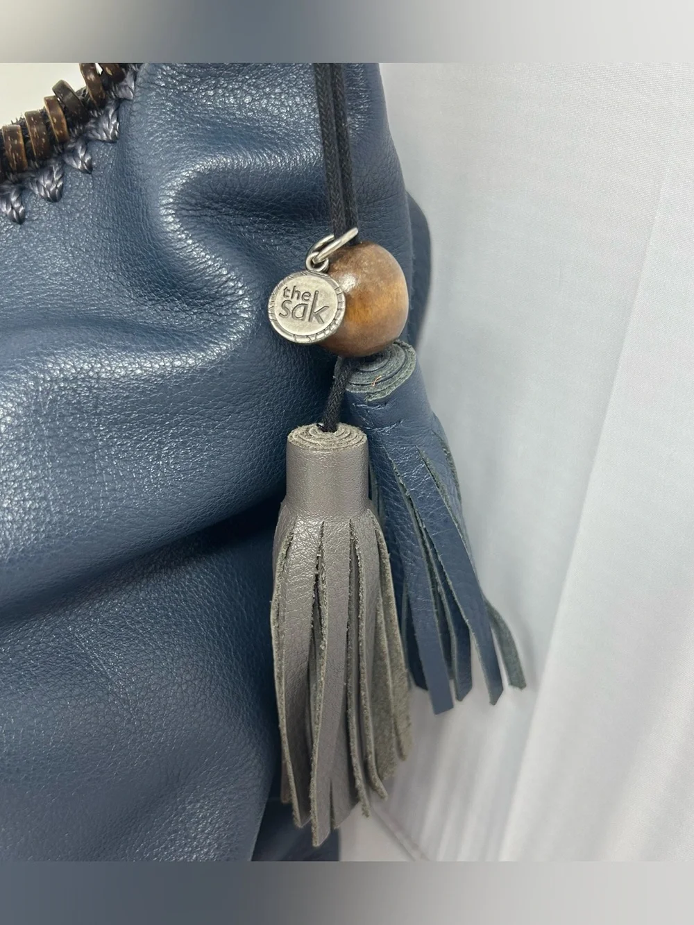 The Sak Boho Leather Hobo Bag slouchy with Beaded Trim and Tassel charm Blue